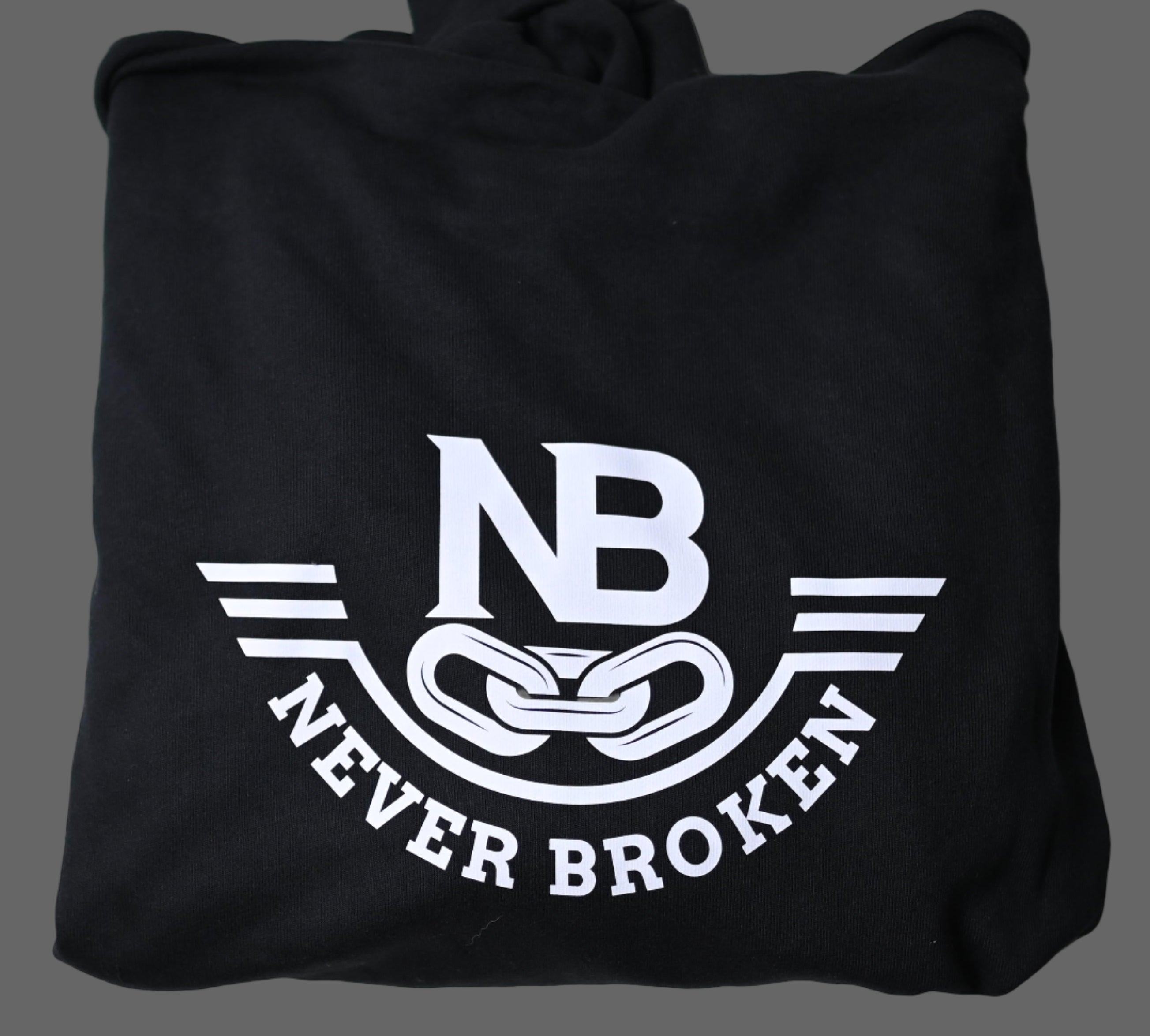 Black t-shirt with 'Never Broken' logo on a white background