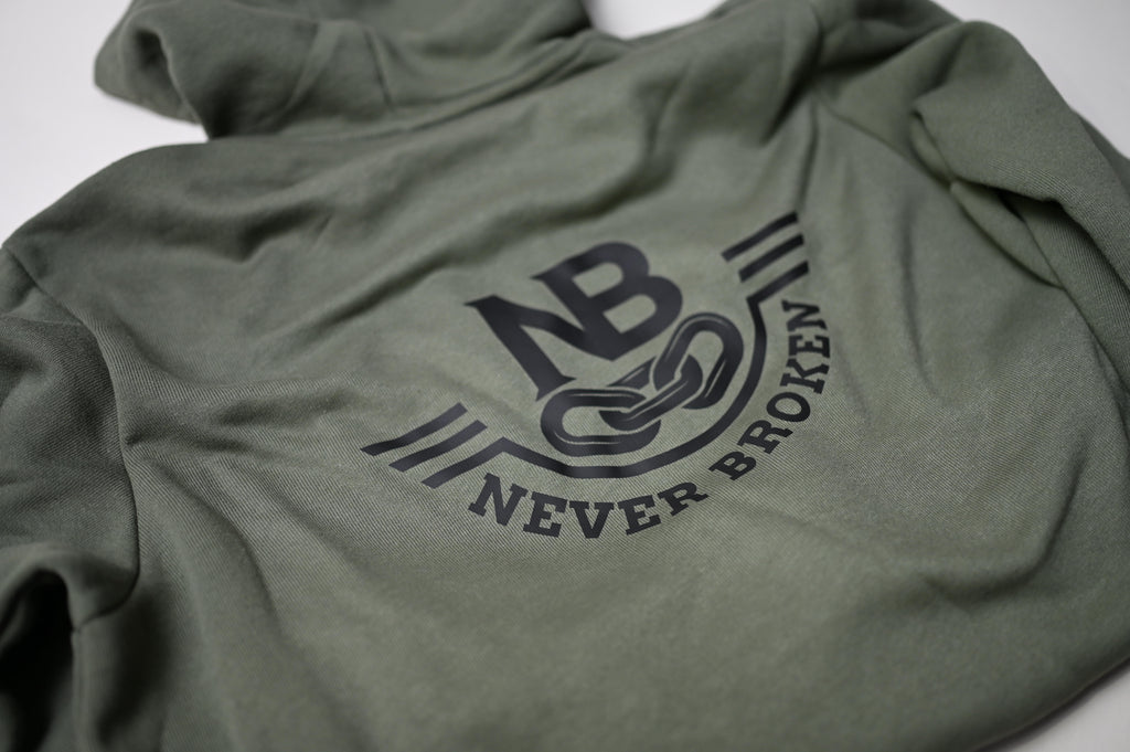 Green hoodie with 'Never Broken' logo on a white background