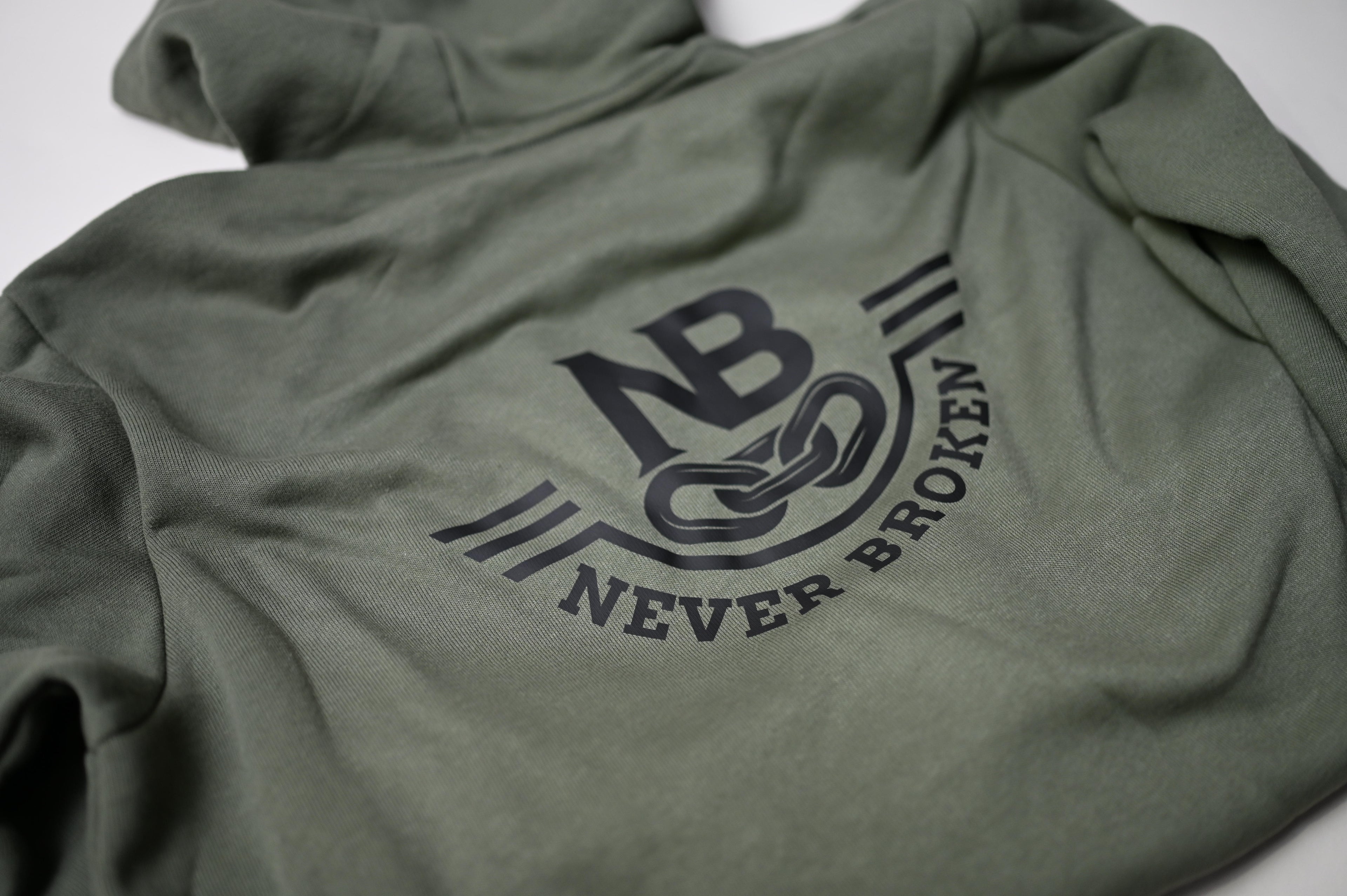 Green hoodie with 'Never Broken' logo on a white background