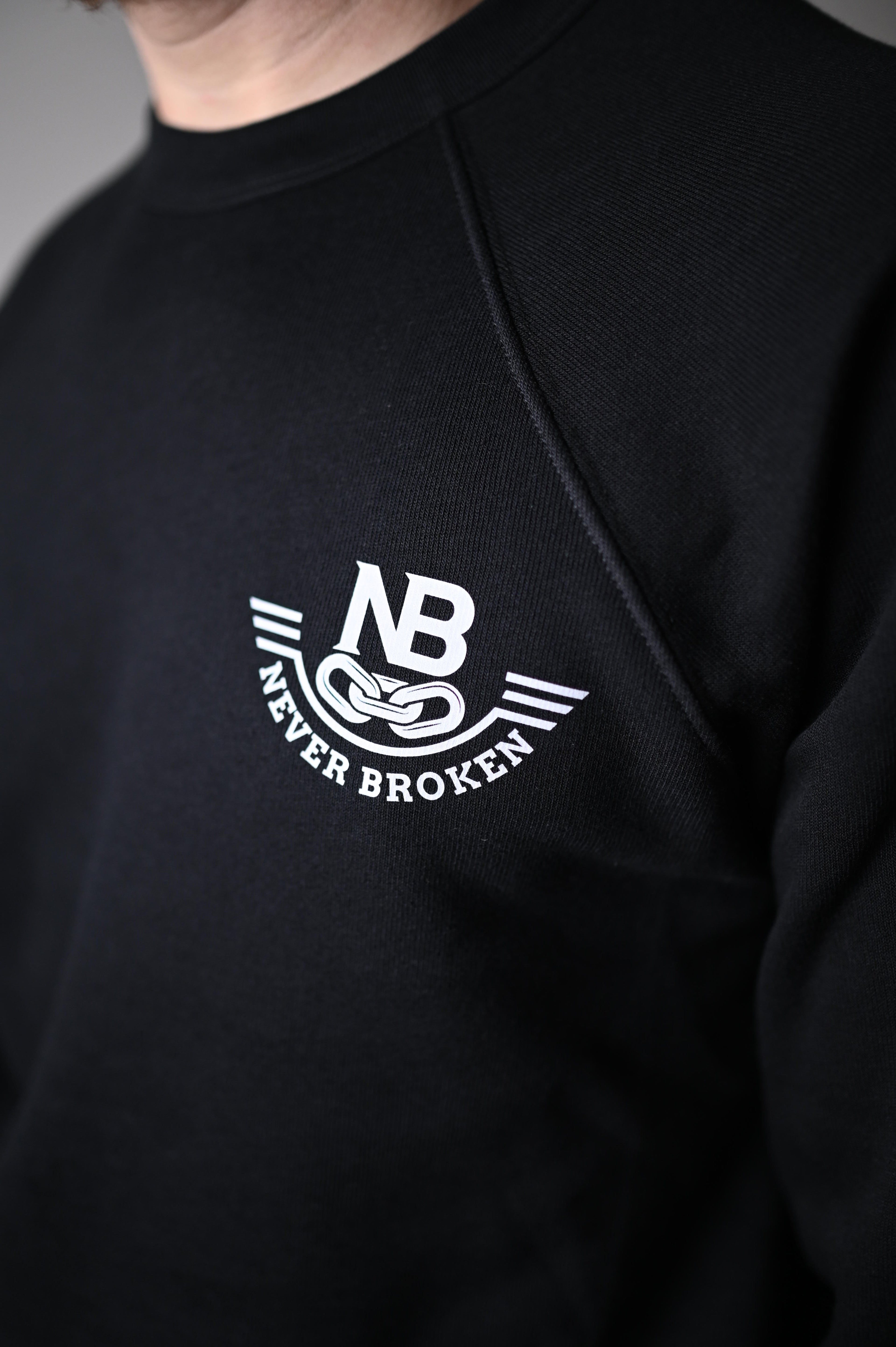 Black hoodie with a white logo on the chest